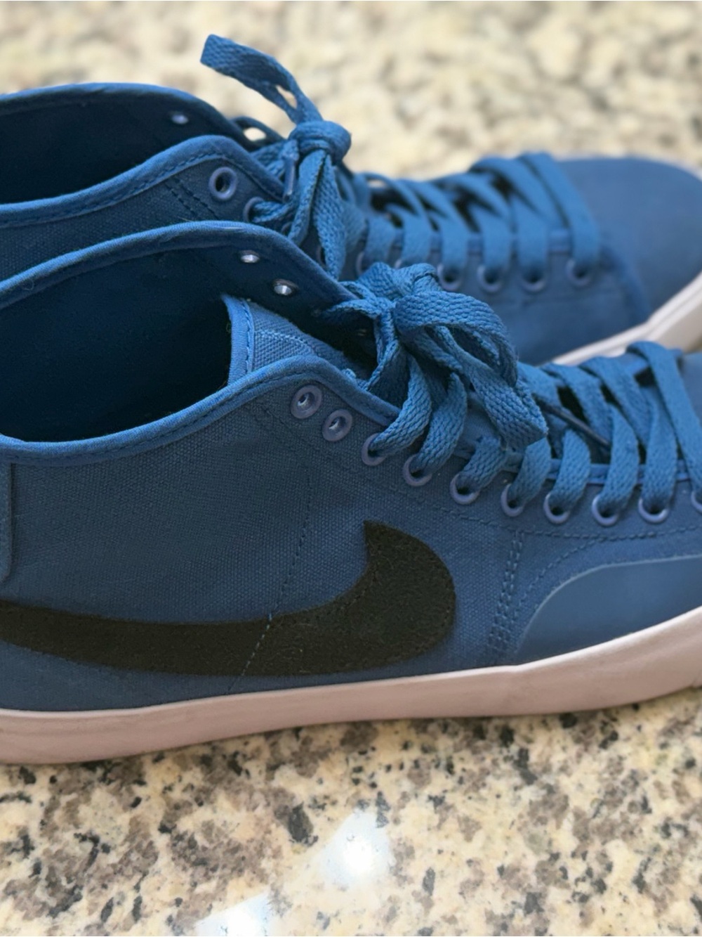 Nike Blue Mid-Top Sneakers with Black Swoosh